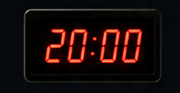 Wall-mounted red LED countdown timer showing 20:00